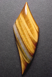 African tigereye with band of translucent quartz.