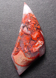 Forest fire jasper's brilliant crimson and beige afloat in a snowy agate/quartz mix.