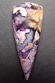 Utah's beryllium opalite, purple-cream-yellow with a hint of plumes in translucent agate.