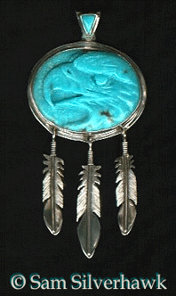 Carved turquoise eagle's head pendant
